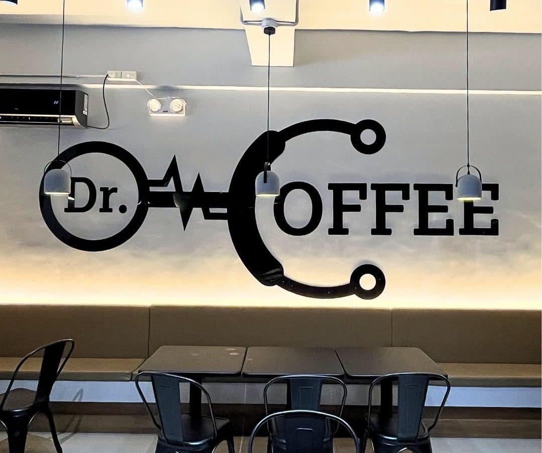 Acrylic cutout signage installed at Dr. Coffee